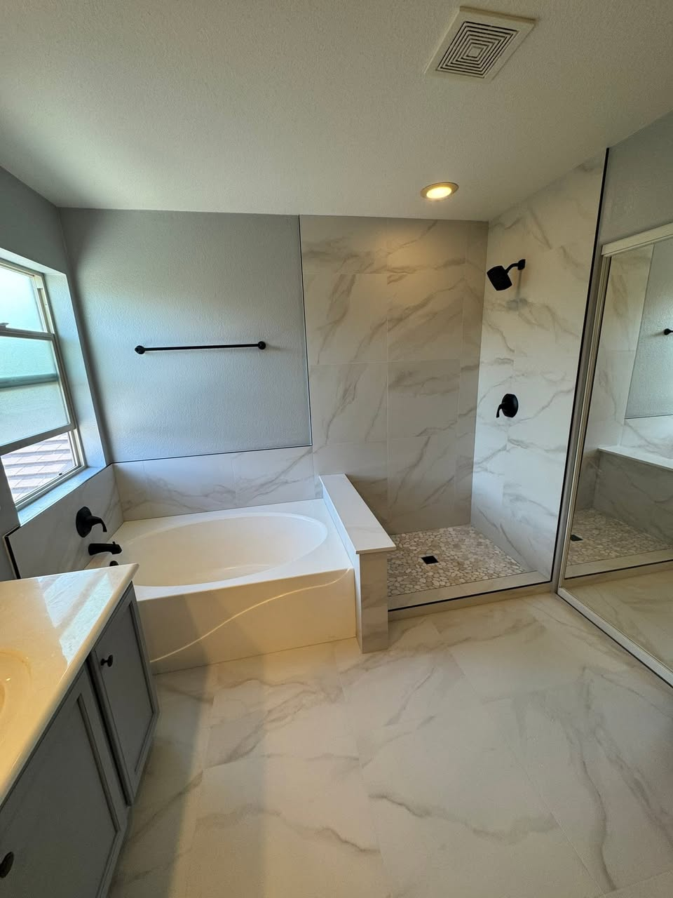 Modern bathroom with large format porcelain tile installation